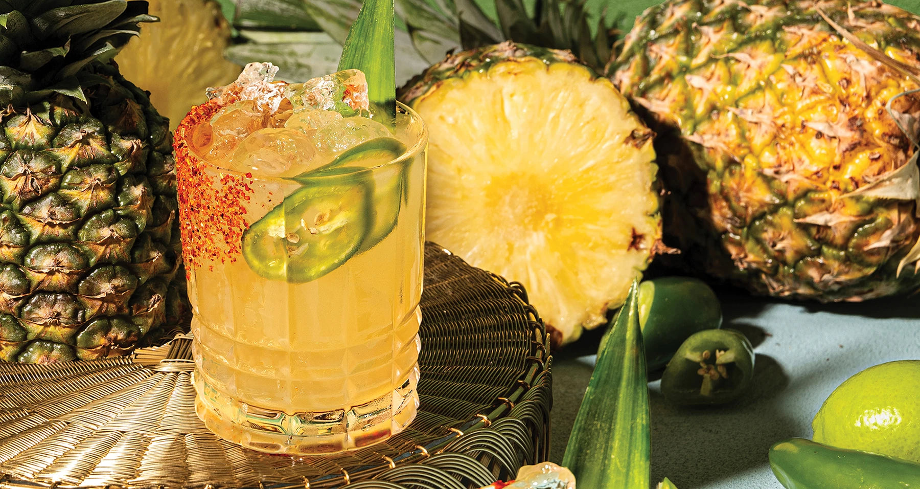 The Dano's Dangerous Spicy Margarita, sitting amidst spiky pineapples, spicy jalapeños and other dangerous, delicious items.